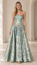 Front view of model wearing strapless floral jacquard maxi ball gown in aqua blue