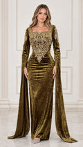 Front full view of woman wearing olive green embroidered velvet evening gown with flowing cape sleeves