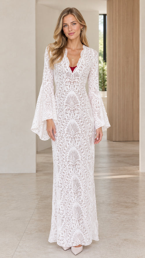 Front view of model wearing white bell sleeve lace maxi dress