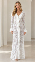 Front view of woman wearing white floral lace V-neck ruffle maxi dress
