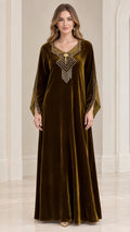 Front view of woman wearing olive green velvet kaftan maxi dress with beaded V-neck fringe