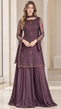 Front view of model wearing plum embroidered tunic and flared pleated sharara pants