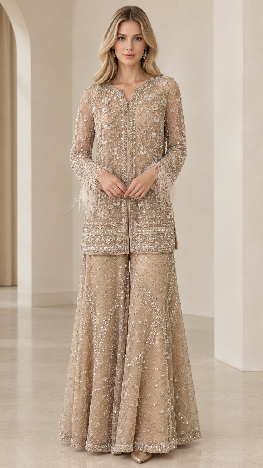Front view of model wearing champagne embellished long tunic and flared palazzo pant set