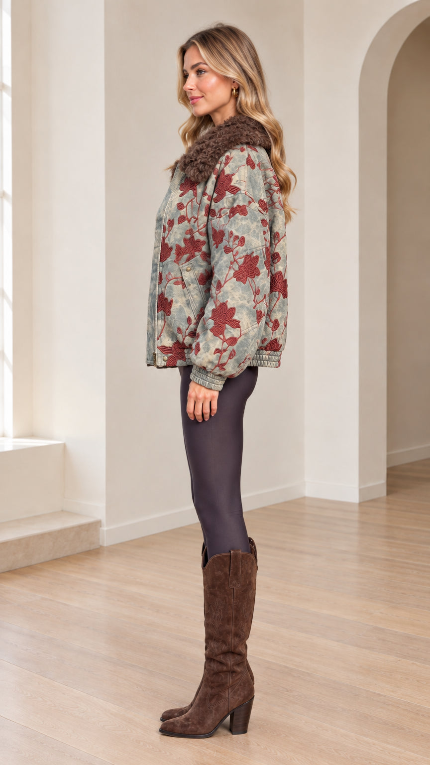 Side view of woman modeling Washed Blue floral embroidered bomber jacket