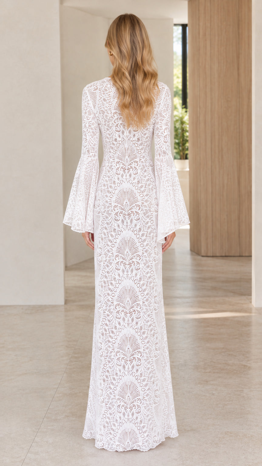Back view of model wearing white long lace dress with flare sleeves