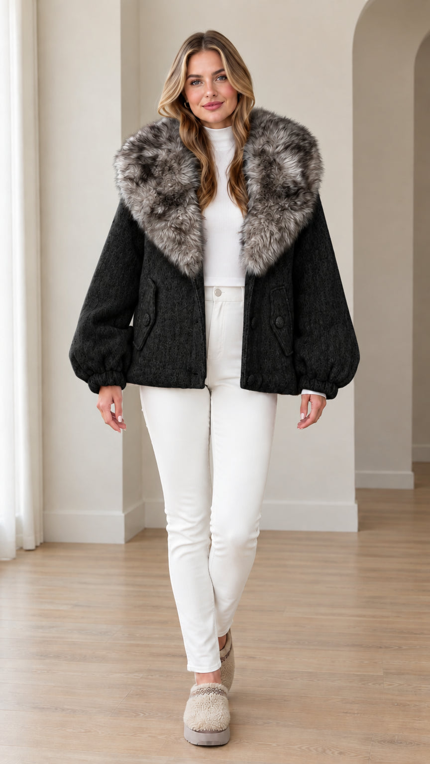 Front view of woman wearing black jacket with frosted faux fur collar
