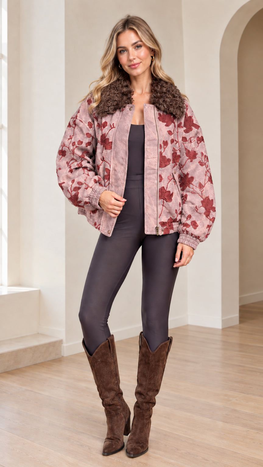 Front view of woman wearing Dusty Pink floral embroidered bomber jacket with faux fur collar