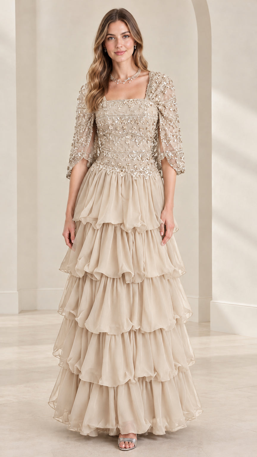 Full view of champagne beige beaded square neck tiered ruffle formal gown